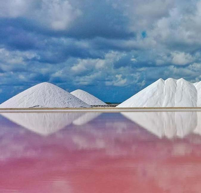 Salt pans for kilometers long with pink fields